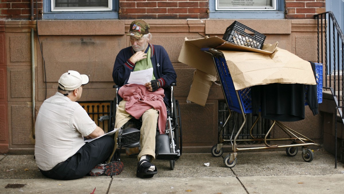 Mark Salvatore, left, a homeless outreach nurse with the Veterans Administration talks with homeless Vietnam veteran William Joyce in Philadelphia, Wednesday, Oct. 24, 2007. A new report scheduled to be released Thursday shows nearly a half-million veterans were homeless last year.(AP Photo/Matt Rourke)