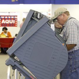 Voters arrive during the first day of early voting at a Travis County mega voting site Monday, Oct. 20, 2008, in Austin, Texas. (AP Photo/Harry Cabluck)