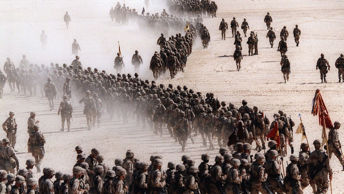 Responding to Iraq's invasion of Kuwait, troops of the U.S. 1st Cavalry Division deploy across the Saudi desert on Nov. 4, 1990 during preparations prior to the Gulf War. (AP Photo/Greg English, File)