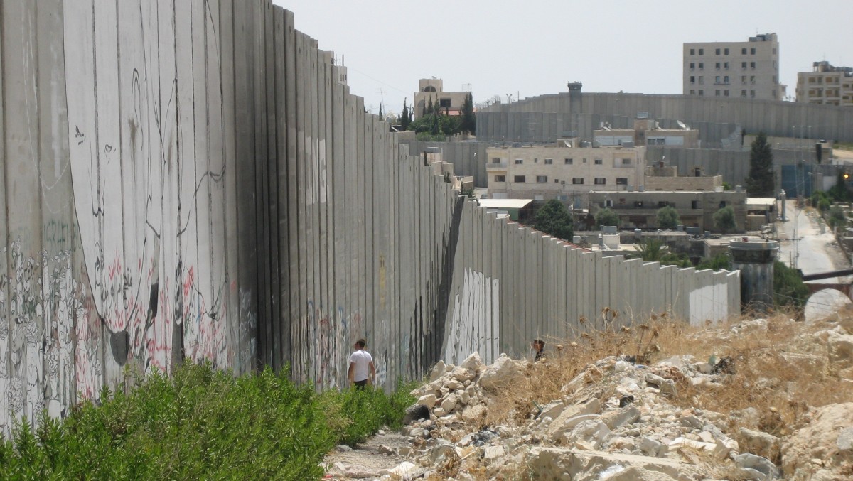 Photo shows the Israeli West Bank Barrier, which surrounds much of the occupied territory, as it passes through  Bethlehem Aida refugee camp.  (Photo/The Advocacy Project via Flickr)