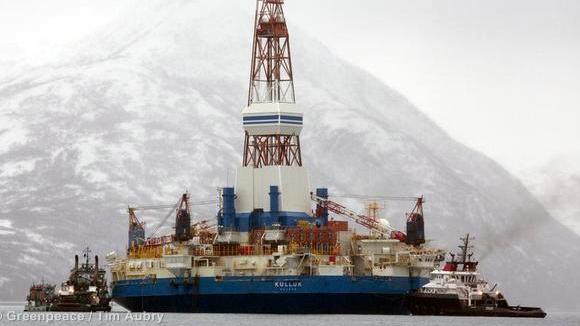 Salvage teams conduct an assessment of Shell's Kulluk drill barge on January 9, 2013 in Kodiak Island's Kiliuda Bay in Alaska. The Kulluk, a circular drill barge without its own propulsion, ran aground New Year's Eve in a powerful storm off the coast of Sitkalidak Island in Alaska. It was being towed to Seattle for maintenance before it ran aground. The Kulluk was being held in place by the tug boats Lauren Foss and Ocean Wave.