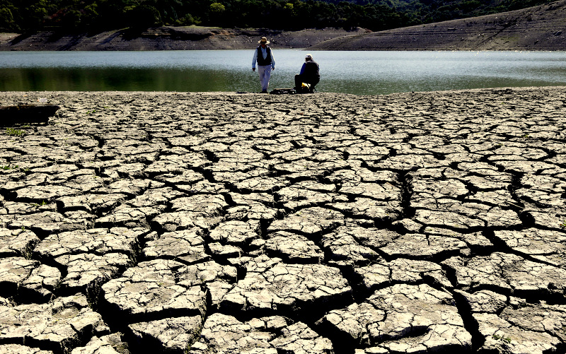 Cracks in the dry bed of the Stevens Creek Reservoir in Cupertino, Calif.