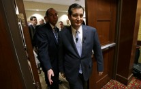 U.S. Sen. Ted Cruz, R-Texas, right, enters the hotel ballroom before speaking at the Network of Iowa Christian Home Educators’ state Capitol day event, Tuesday, March 18, 2014, in Des Moines, Iowa. Cruz has made four trips to Iowa in eight months.