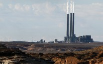 A coal-burning facility at the Navajo Generating Station, as seen from Lake Powell in Page, Ariz. (AP Photo/Ross D. Franklin, File)