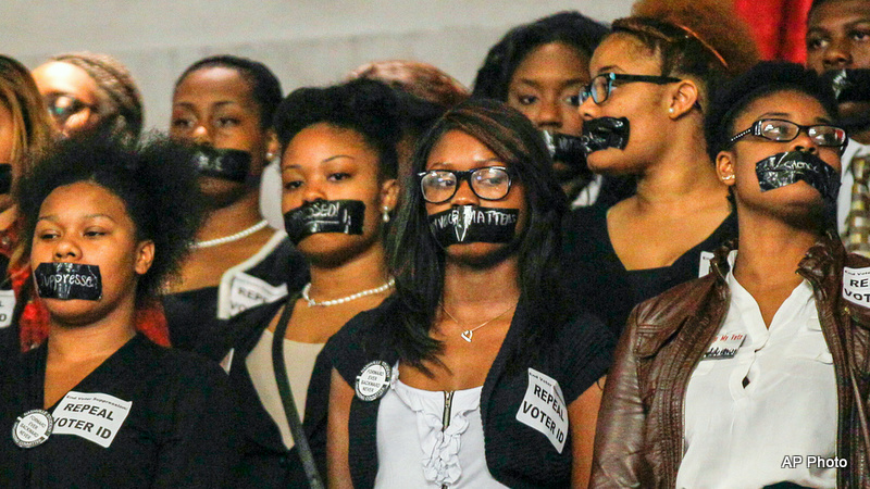 Voter ID: Members of the Nashville Student Organizing Committee stage a silent protest in the gallery of the House chamber in Nashville, Tenn., Monday, March 24, 2014. The group opposes a state law that prevents student IDs to be used to vote in Tennessee.