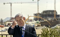 Israeli Prime Minister Benjamin Netanyahu speaks as he visits a settlement construction site in Har Homa