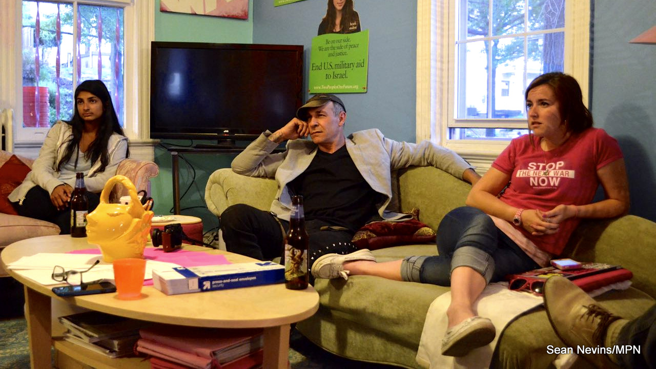 Code Pink activists and organizers, Nalini, 19, Doug, 51, and Alli, 26, look on as John Kiriakou, former CIA analyst and operations officer, talks about political prisoners on May 20 in Washington DC.