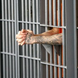 An inmate stands at his cell door at the maximum security facility at the Arizona