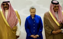 Saudi Foreign Minister Prince Saud Al-Faisal, right, U.S. Secretary of State Hillary Clinton, center, and Kuwaiti Foreign Minister Sheikh Sabah Khaled al-Hamad Al-Sabah, left, stand together prior to a group photo
