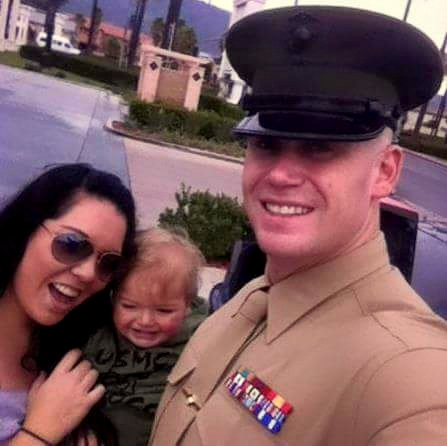 Kristoffer Lewandowski, pictured with his wife Whitney and child.