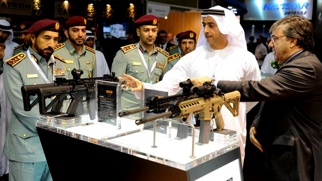 Sheikh Mohammed bin Rashid Al Maktoum, Ruler of Dubai, inspects the goods at the 2013 DSEi international arms fair.