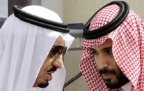 Saudi King Salman, left, speaks with his son Prince Mohammed bin Salman as they wait for Gulf Arab leaders ahead of the opening of a Gulf Cooperation Council summit, in Riyadh, Saudi Arabia. On Wednesday, April 29, 2015. (AP Photo/Hassan Ammar)