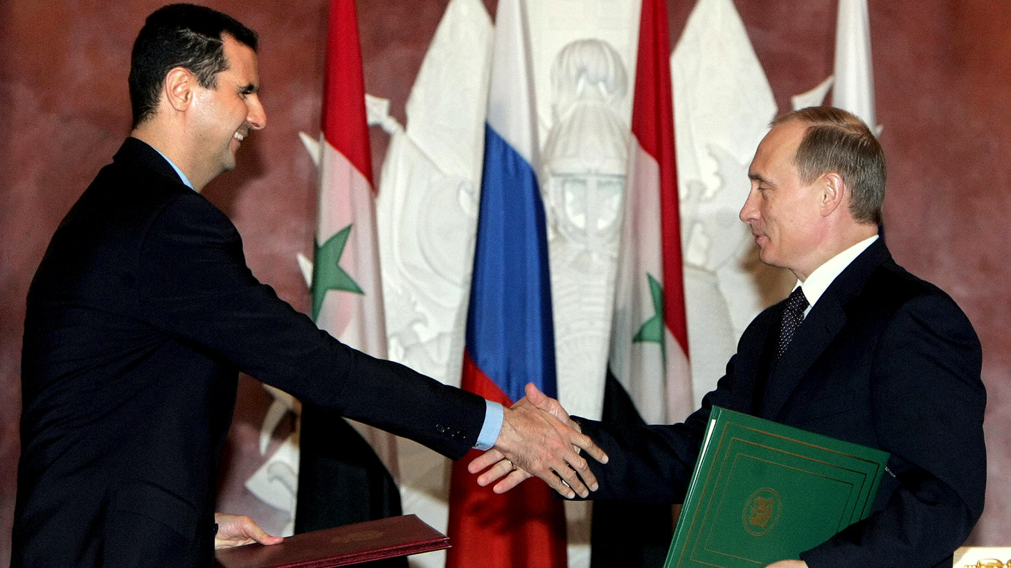 Syrian President Bashar Al Assad (left) and his Russian counterpart Vlamidir Putin (right)