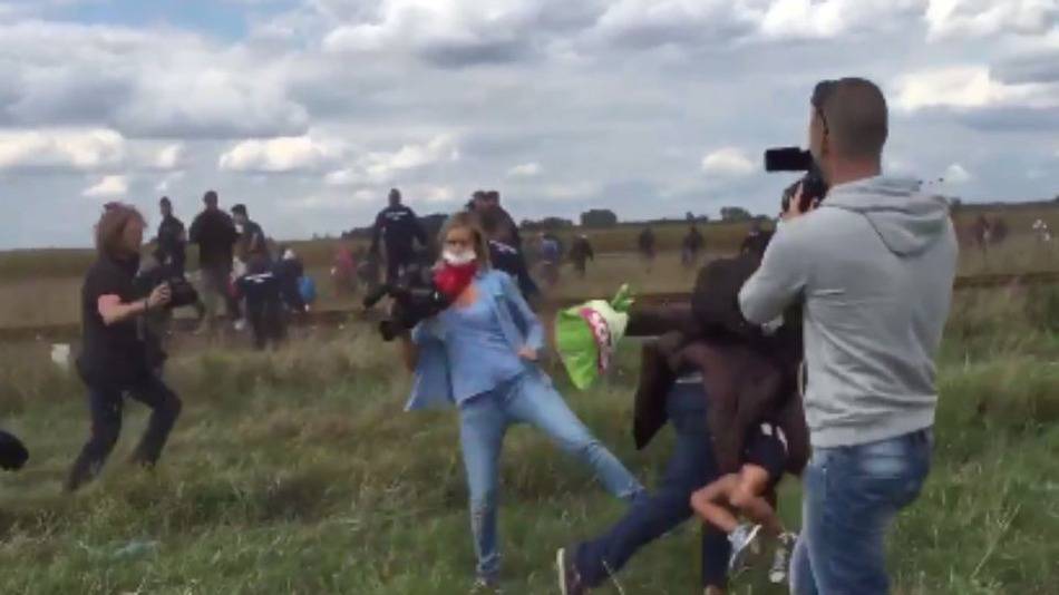 Footage shows a videographer tripping a man and child fleeing police in Hungary on September 8, 2015.