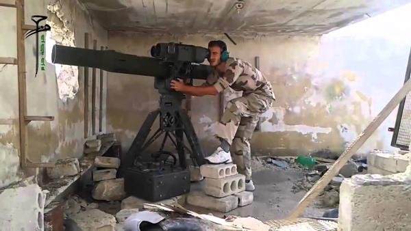 A Syrian rebel firing a TOW missle.
