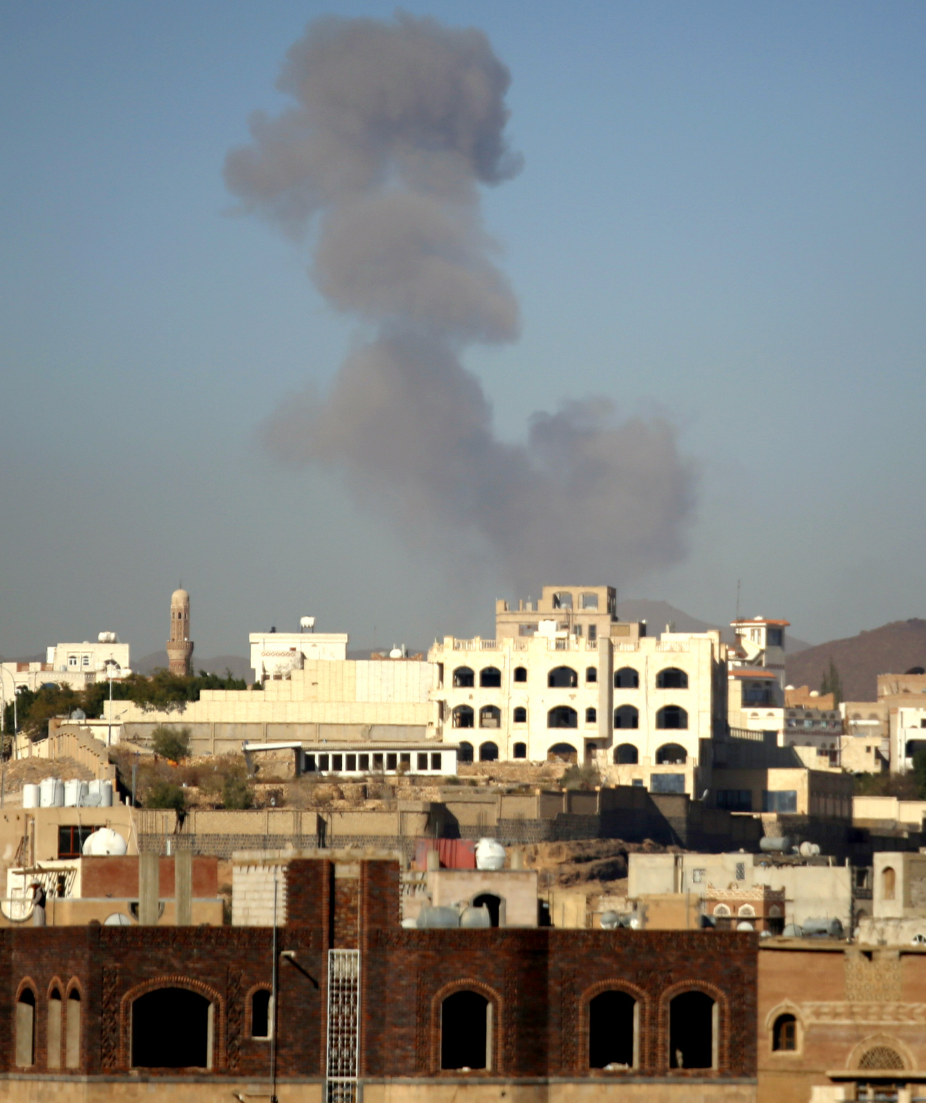 Smoke rises after a Saudi-led airstrike hits an army base in Sanaa, Yemen, Saturday, Dec. 5, 2015. (AP Photo/Hani Mohammed)