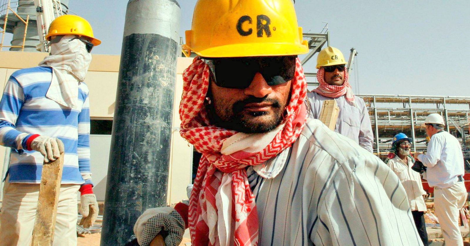 Workers at an oil facility near Riyadh, Saudi Arabia. Photo: (Hasan Jamali | AP)