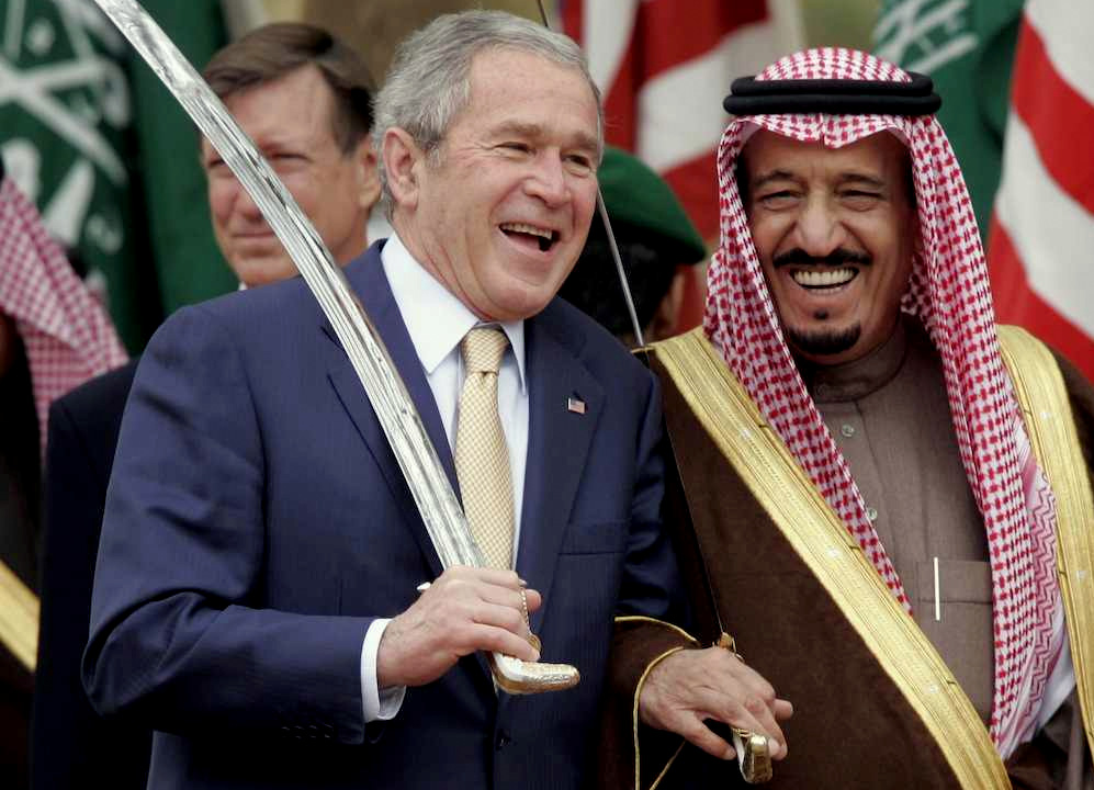 King Salman, the current ruler of Saudi Arabia, poses with former U.S. president George W. Bush. (AP Photo)