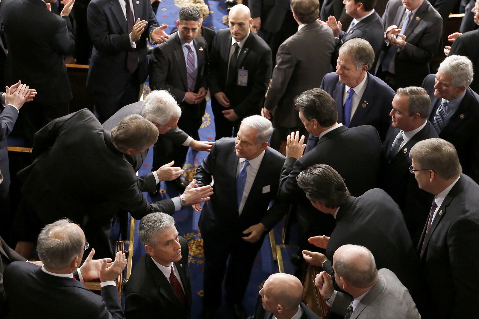 Members of Congress rush to greet Israeli Prime Minister Benjamin Netanyahu as he leaves the House chamber on Capitol Hill in Washington, Tuesday, March 3, 2015, after lobbying Congress to kill a peace plan with Iran at all costs. Studies show that more than half of Congress will themselves go on to become lobbyists. (AP Photo/Andrew Harnik)