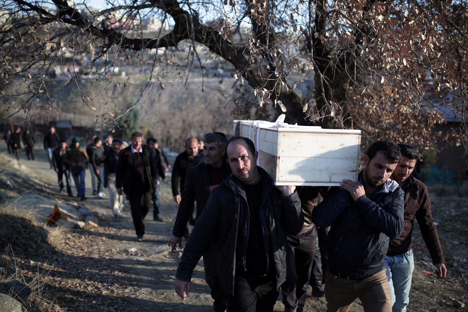 People carry the coffin of Mehmet Tekin, 38, who was killed during clashes in Cizre in southeastern Turkey. (AP Photo/Cagdas Erdogan)