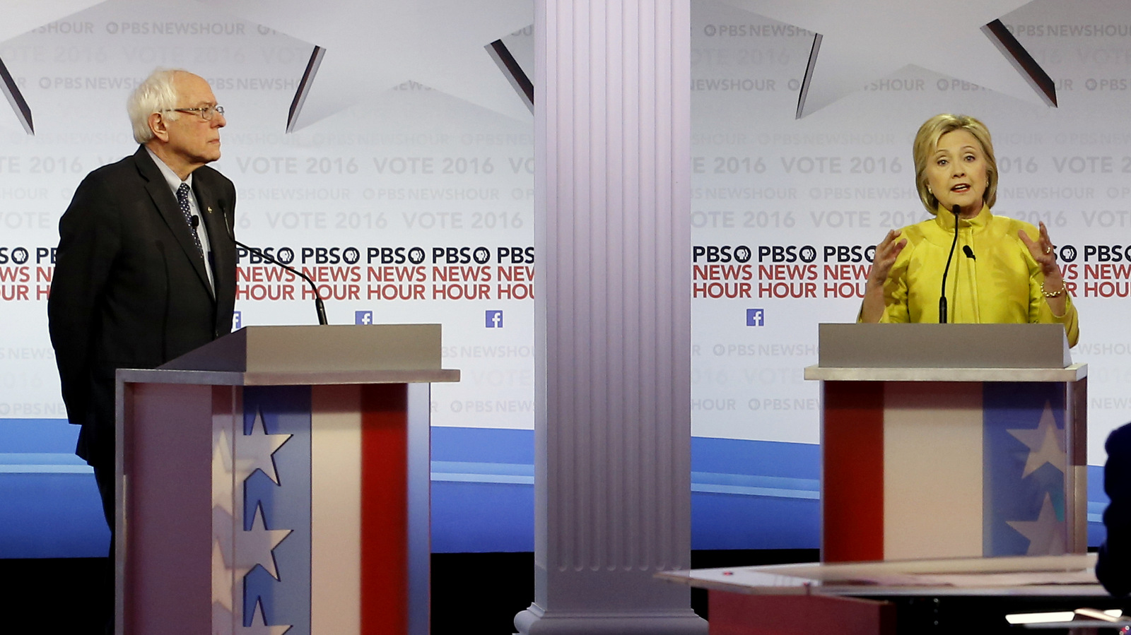 Democratic presidential candidate, Hillary Clinton, right, makes a point as Sen. Bernie Sanders, I-Vt, listens during a Democratic presidential primary debate at the University of Wisconsin-Milwaukee, Thursday, Feb. 11, 2016, in Milwaukee. (AP Photo/Morry Gash)