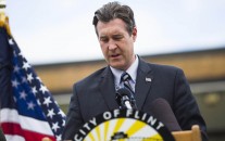 Flint Mayor Dayne Walling speaks during a news conference, Friday, Oct. 16, 2015, outside Ralph M. Freeman Elementary School in Flint, Mich. (Danny Miller/The Flint Journal-MLive.com via AP
