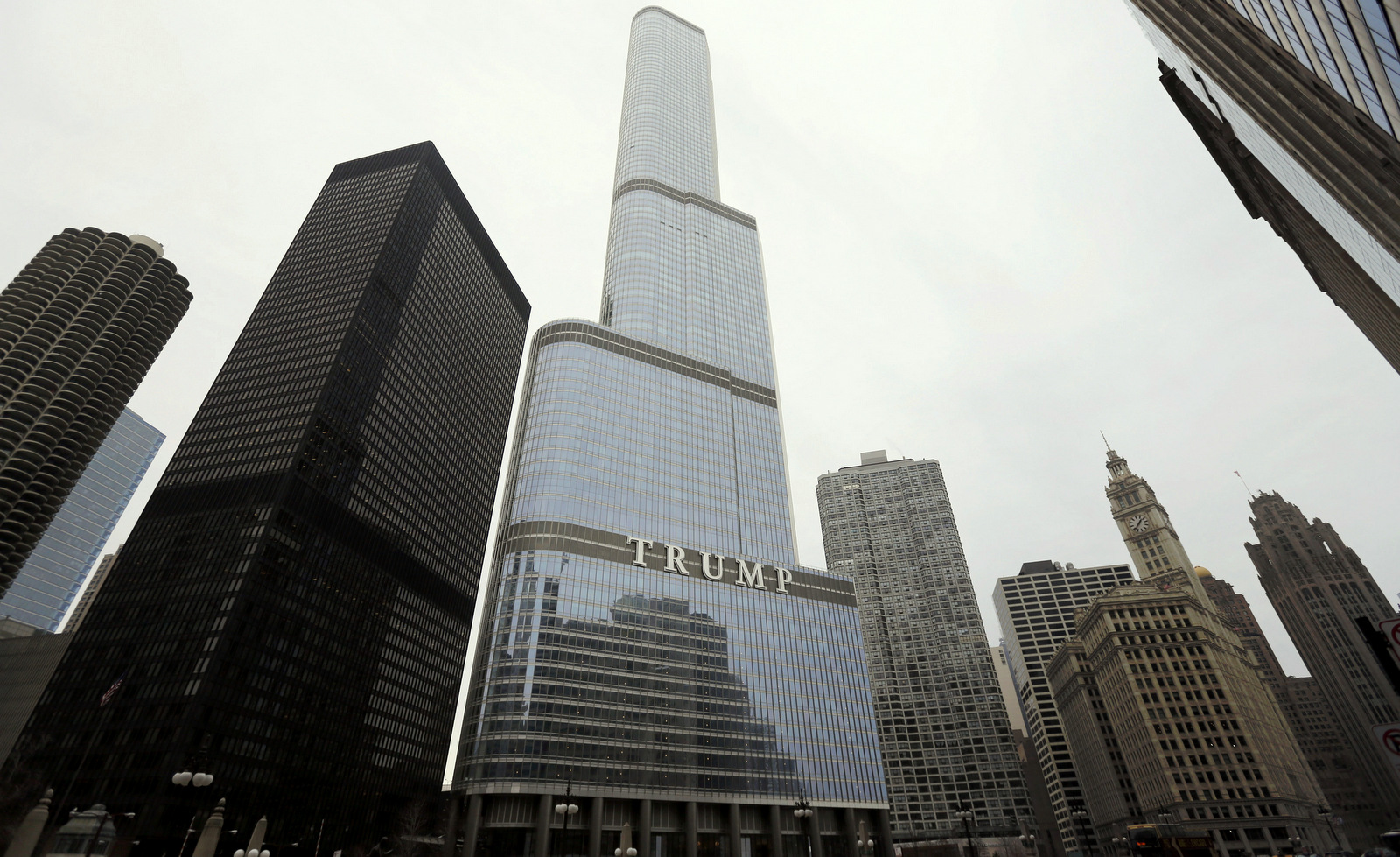 In this Thursday, March 10, 2016, photo is the Trump International Hotel and Tower in Chicago. Republican presidential candidate Donald Trump has pledged to scrap a work visa program that brings 300,000 student workers each year to the U.S. Among the businesses that would be forced to stop hiring foreign labor: Trump's own. (AP Photo/Charles Rex Arbogast)