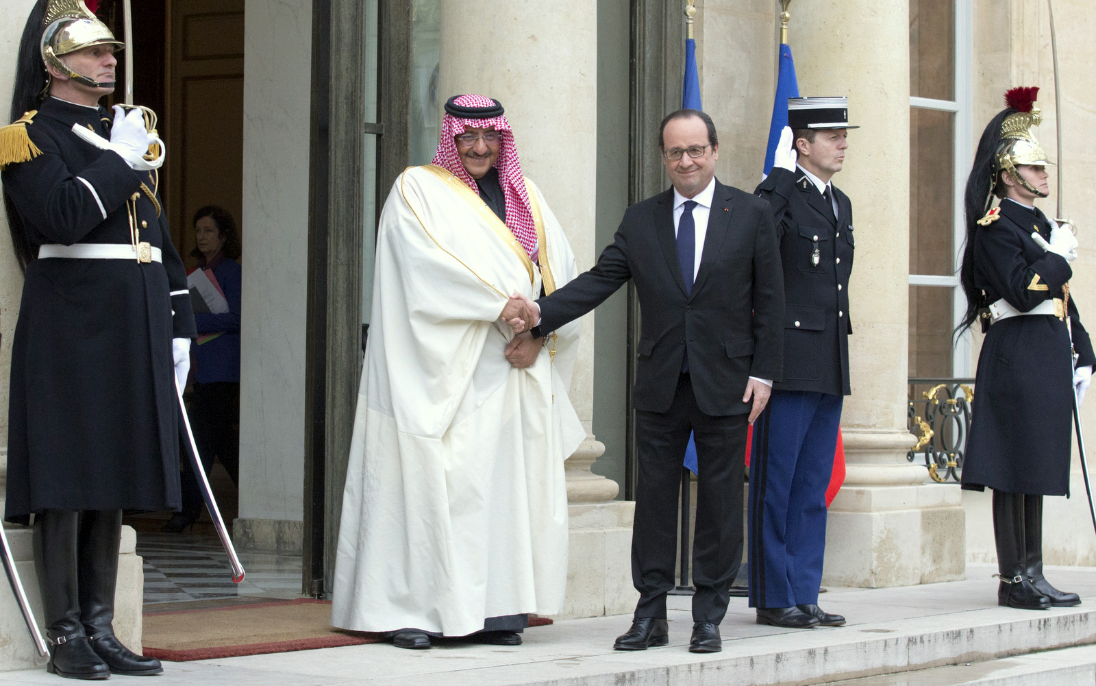 French president Francois Hollande, left, welcomes Crown Prince, First Deputy Prime Minister and the Minister of Interior of Saudi Arabia Muhammad bin Nayef bin Abdulaziz upon his arrival in Paris, Friday, March 4, 2016. (AP Photo/Jacques Brinon)