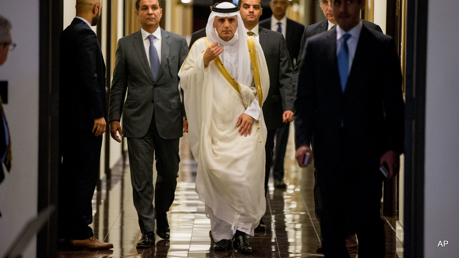 Saudi Arabia Foreign Minister Adel al-Jubeir, center, arrives to speak at a news conference at the Saudi Arabian Embassy in Washington, Friday, June 17, 2016. (AP Photo/Andrew Harnik)