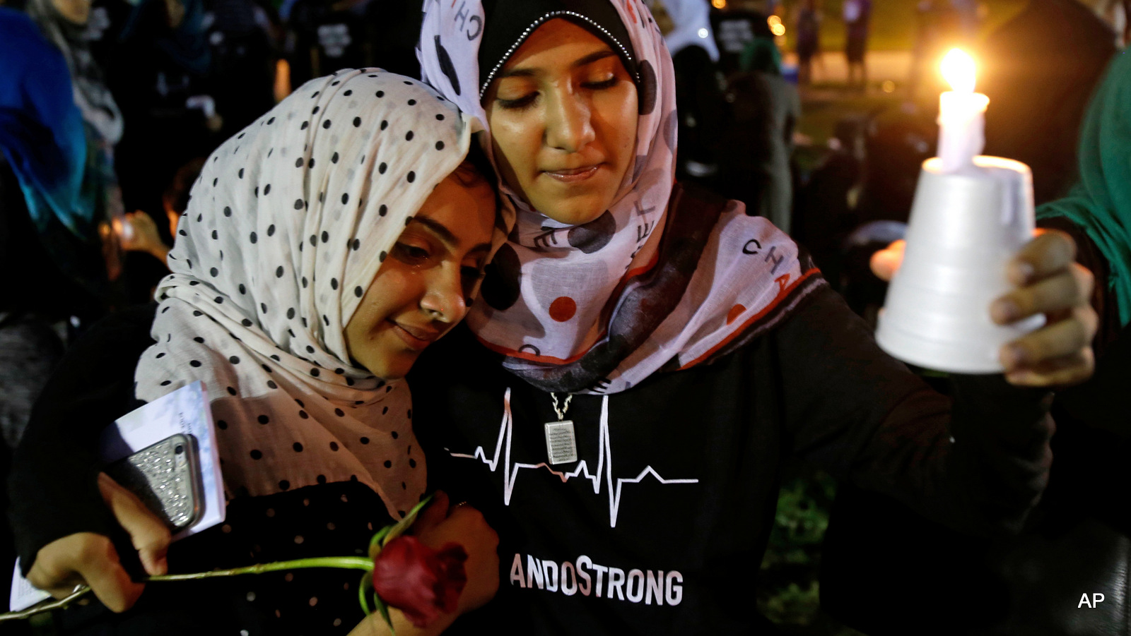 Supporters of the victims of the recent mass shooting at the Pulse nightclub attend a vigil at Lake Eola Park, Sunday, June 19, 2016, Orlando, Fla. Tens of thousands of people attended the vigil.