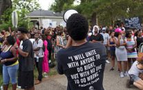 Protesters demonstrate a residential neighborhood in Baton Rouge, La. on Sunday, July 10, 2016.