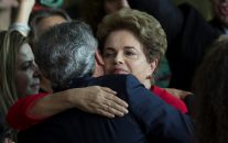 Brazil's ousted President Dilma Rousseff is embraced by the senator Jorge Viana, after she addressed supporters from the official residence of the president, Alvorada Palace in Brasilia, Brazil, Wednesday, Aug. 31, 2016.