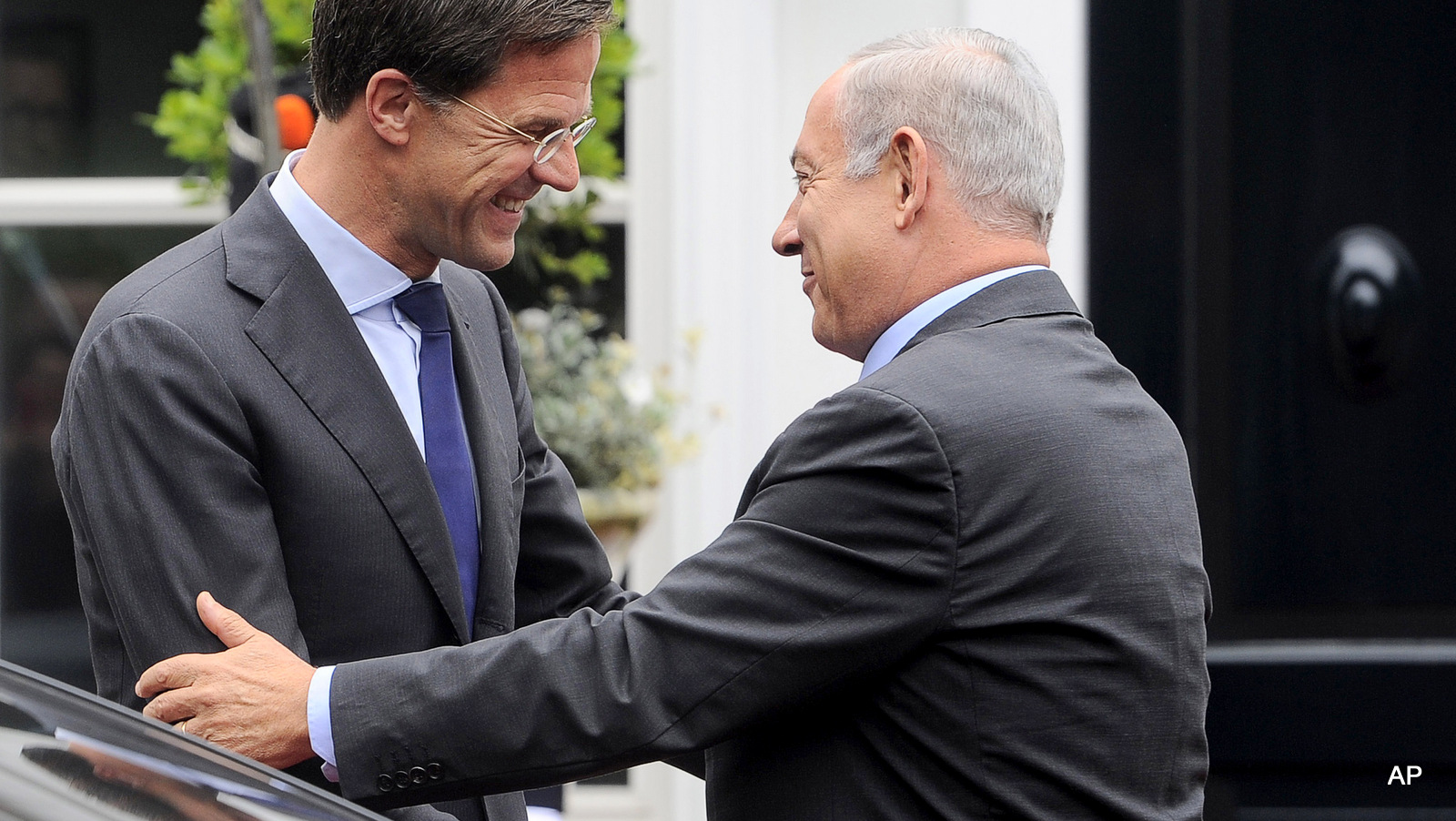 Israel's Prime Minister Benjamin Netanyahu, right, is greeted by Dutch Prime Minister Mark Rutte prior to a meeting in The Hague, Netherlands, Tuesday, Sept. 6, 2016.
