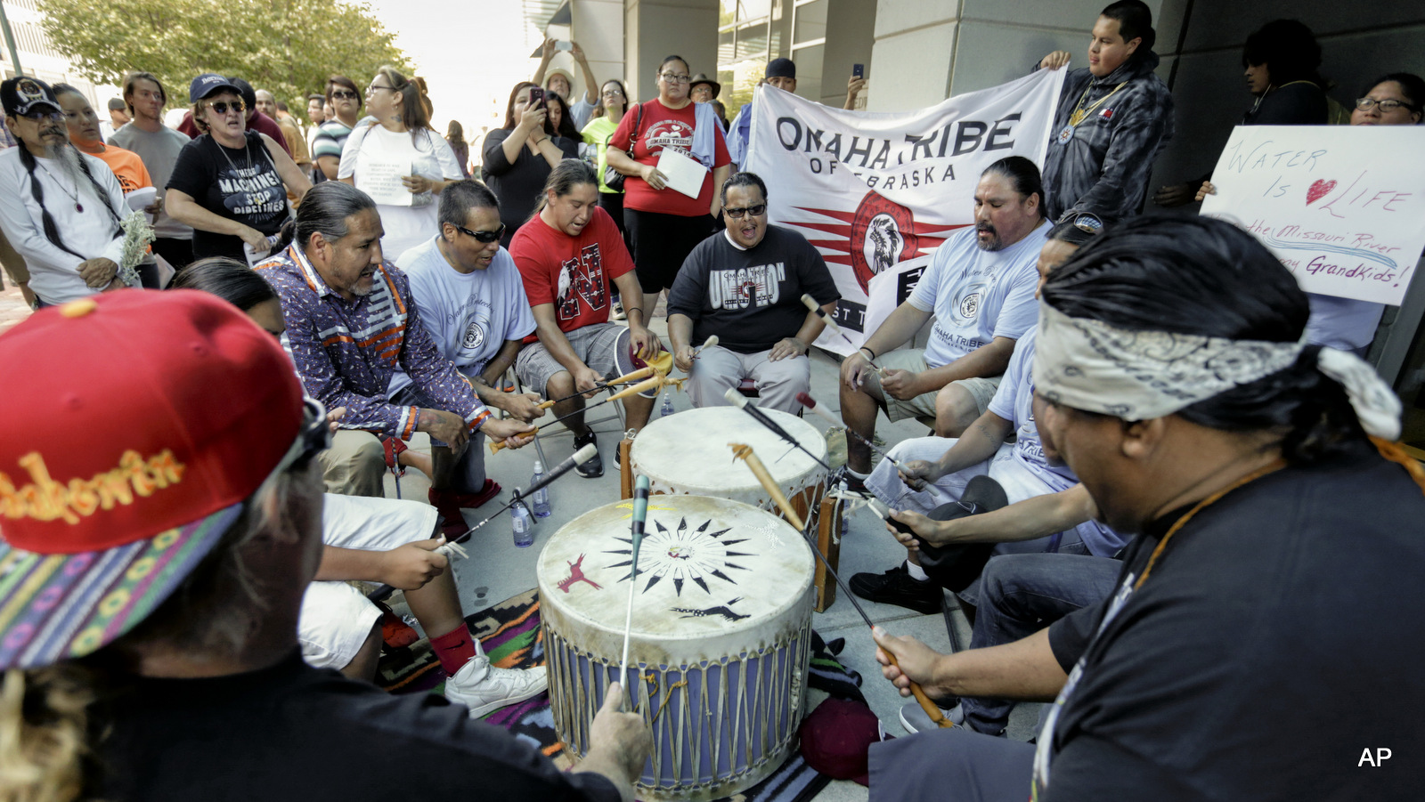 Members of the Ponca, Santee, Winnebago and Omaha Tribes in Nebraska and Iowa along with others participate gather during a rally on Thursday, Sept. 8, 2016, in front of the Army Corps of Engineers offices in Omaha, Neb., to protest against the Dakota Access Pipeline in the Dakotas and Iowa. 