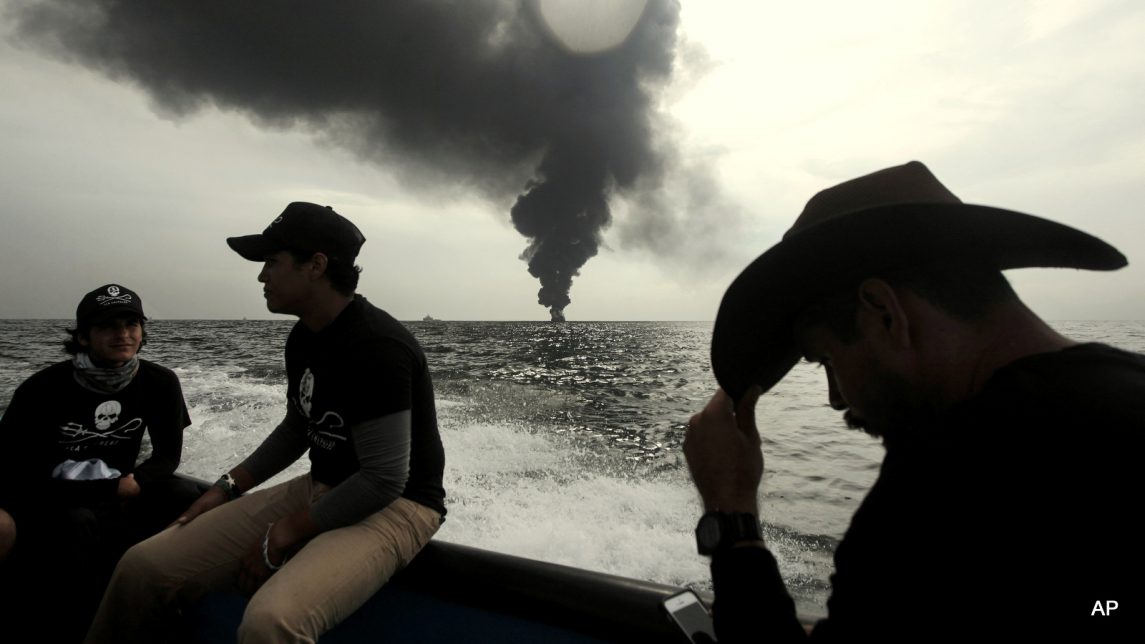 Members of the marine wildlife conservation organization Sea Shepherd monitor the fuel tanker Burgos, as it continues to burn a day after it erupted in flames off the coast of the port city of Boca del Rio, Mexico, Sunday Sept. 25, 2016. Firefighting boats were battling the blaze aboard the Burgos, which is owned by state oil company Petroleos Mexicanos, or Pemex. Pemex said in a statement Sunday that a team of international experts in putting out fires and transferring fuel has arrived to assist.