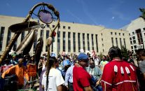 An Eagle Staff is held up as Native Americans gather during a rally outside U.S. District Court in Washington, Wednesday, Aug. 24, 2016, in solidarity with the Standing Rock Sioux Tribe in their lawsuit against the Army Corps of Engineers to protect their water and land from the Dakota Access Pipeline. A federal judge in Washington considered a request by the Standing Rock Sioux for a temporary injunction against an oil pipeline under construction near their reservation straddling the North Dakota-South Dakota border.