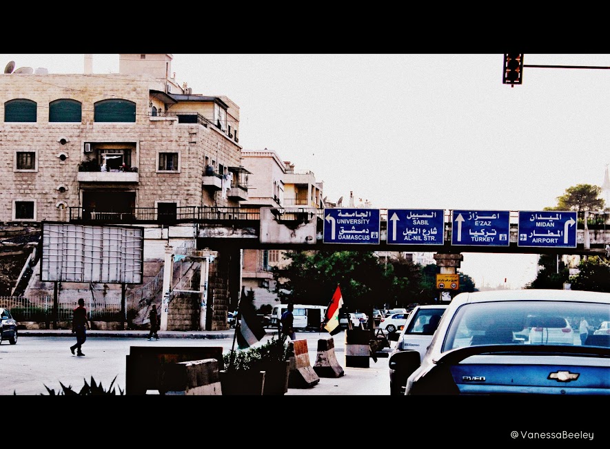 Driving through western Aleppo at dusk. (Photo by Vanessa Beeley)