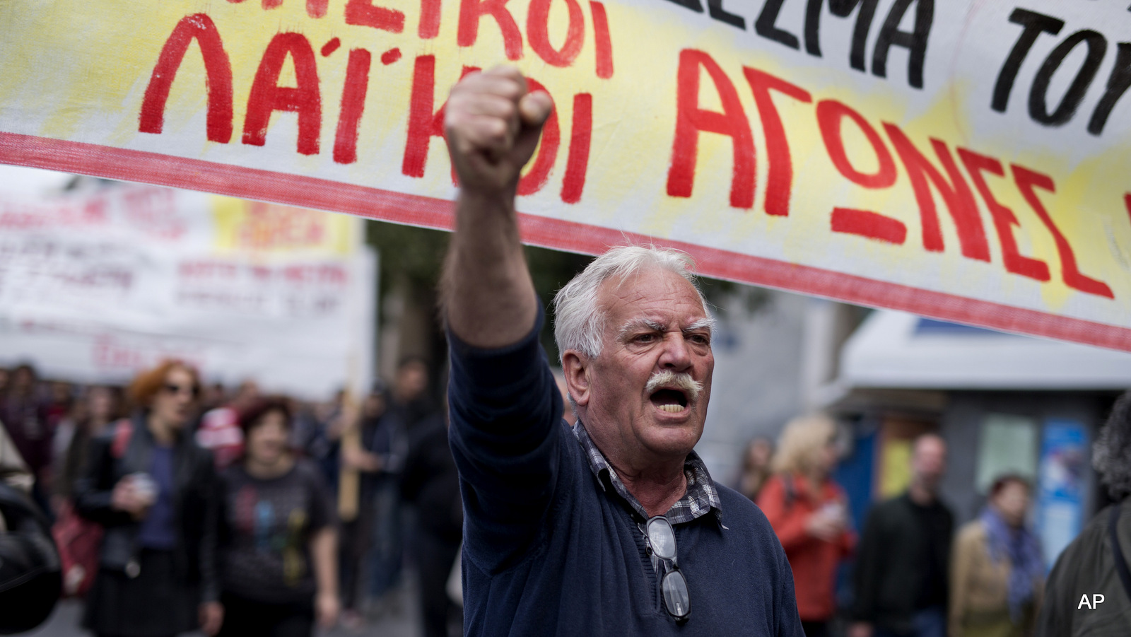 A protester chants anti austerity slogans during a demonstration in central Athens, on Friday, May 6, 2016. A protester chants anti austerity slogans during a demonstration in central Athens, on Friday, May 6, 2016. 