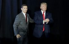 Retired Gen. Michael Flynn, left, introduces Republican presidential candidate Donald Trump at a campaign rally, Thursday, Sept. 29, 2016, in Bedford, N.H. (AP Photo/John Locher)