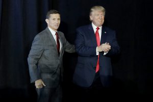 Retired Gen. Michael Flynn, left, introduces Republican presidential candidate Donald Trump at a campaign rally, Thursday, Sept. 29, 2016, in Bedford, N.H. (AP Photo/John Locher)
