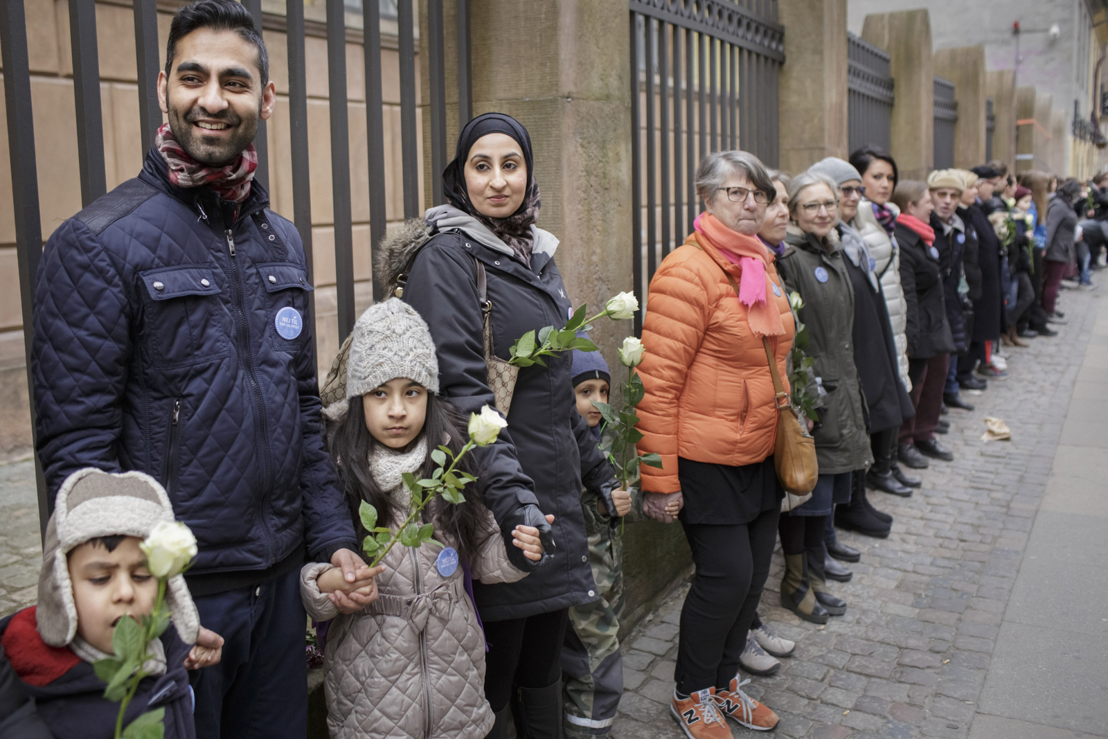 Danish people of Muslim, Jewish and Christian faith form a peace ring around the synagogue in Copenhagen, Saturday, March 14, 2015. (AP Photo/Mads Nissen/Polfoto)