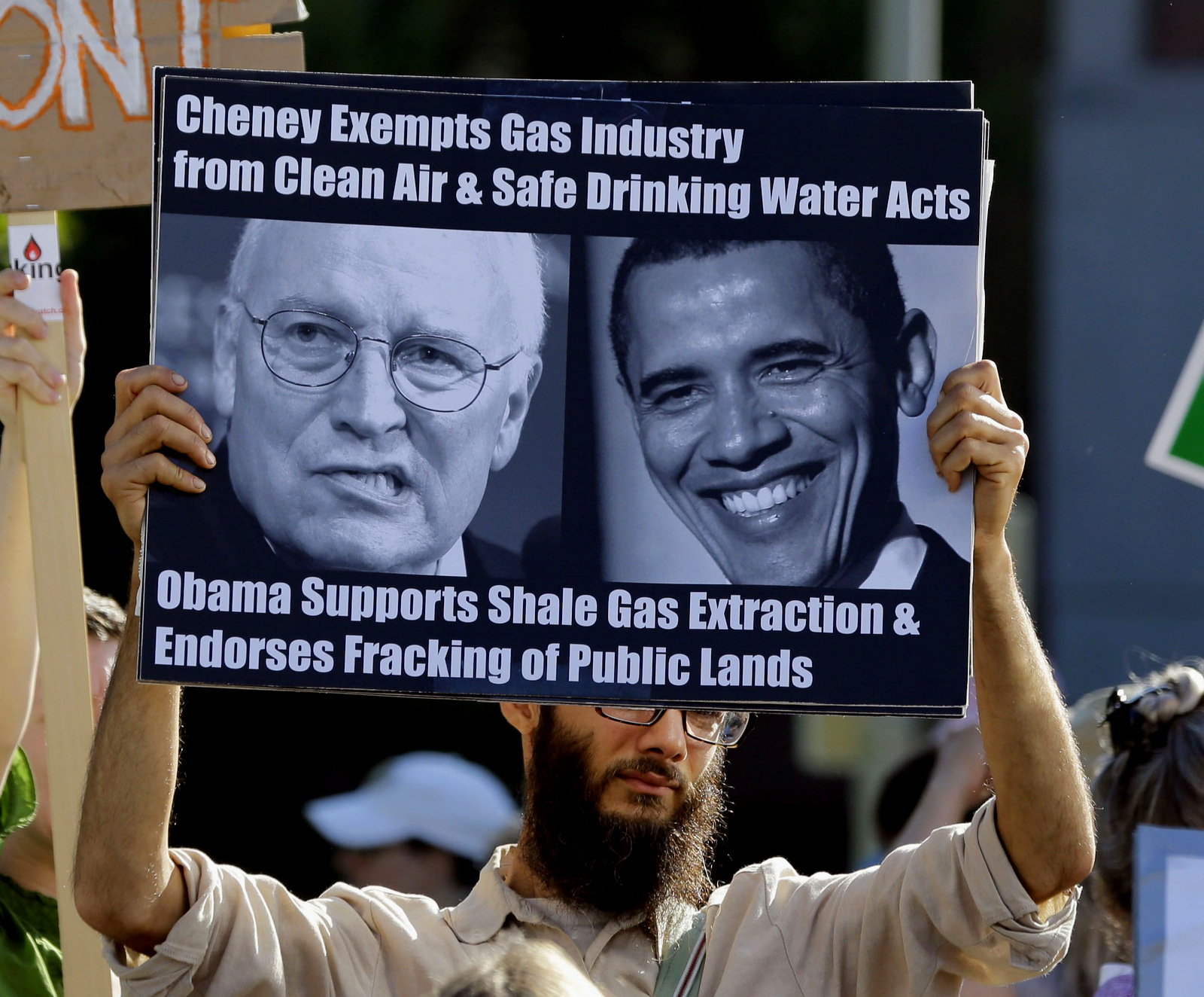 Opponents of hydraulic fracturing for natural gas, or fracking, demonstrate on the campus of Binghamton University hours before President Barack Obama is scheduled to speak about affordable college education during a town hall meeting, Friday, Aug. 23, 2013, in Vestal, N.Y. (AP/Mike Groll)
