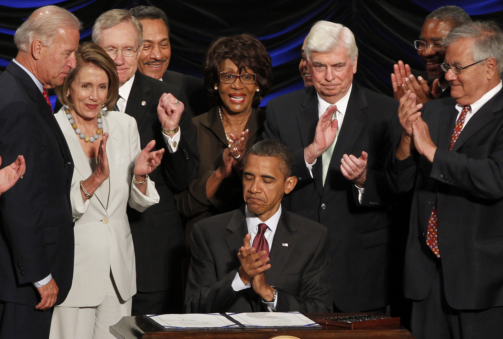 Barack Obama signs the Dodd-Frank Wall Street Reform and Consumer Protection financial overhaul bill at the Ronald Reagan Building in Washington, Wednesday, July 21, 2010. (AP/Charles Dharapak)