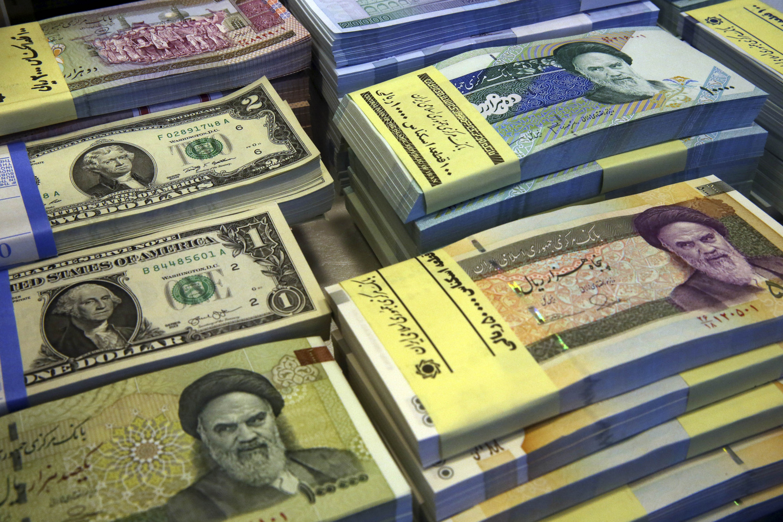  Iranian and U.S. banknotes are on display at a currency exchange shop in downtown Tehran, Iran. (AP/Vahid Salemi)