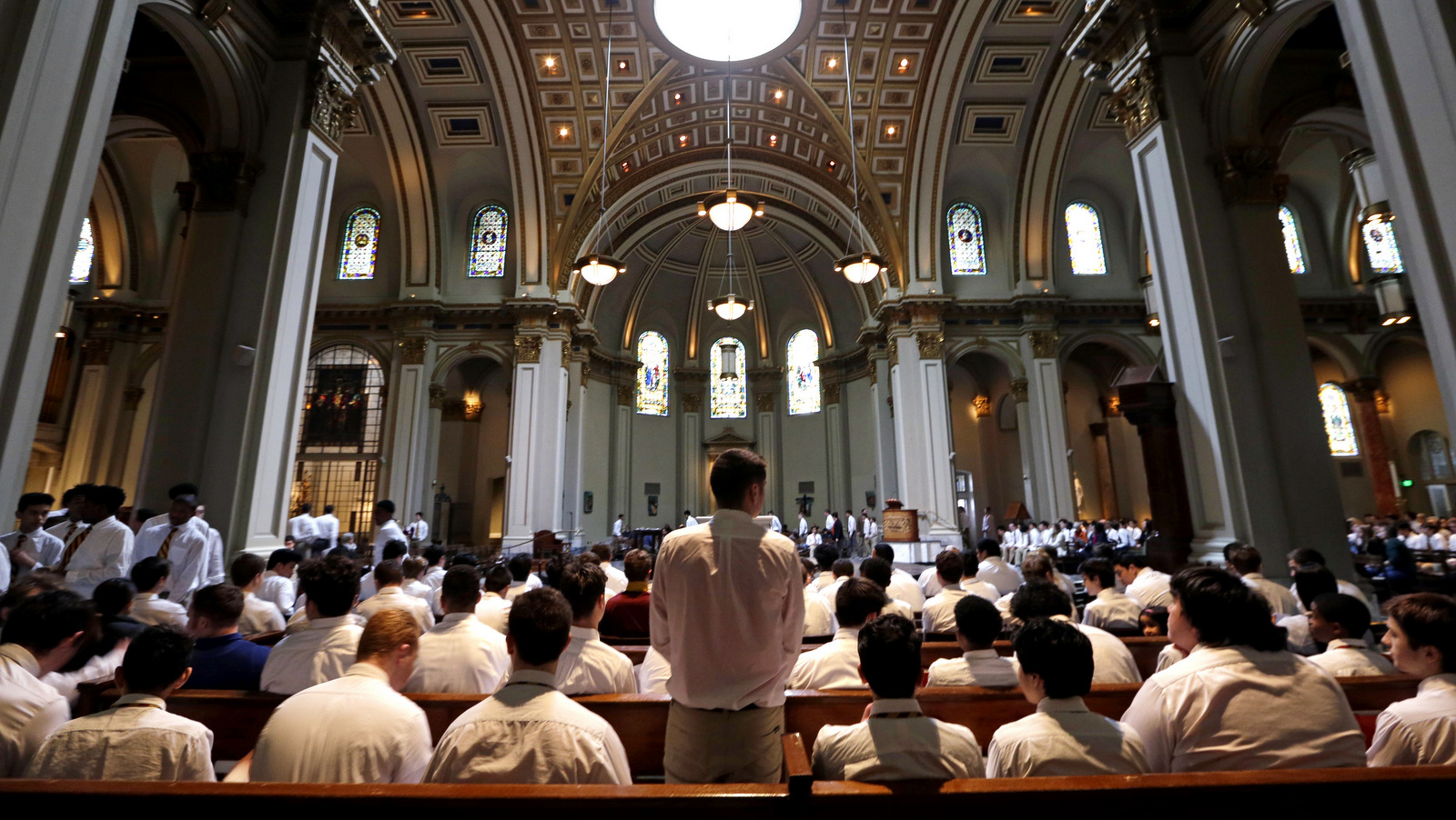 O'Dea High School students settle into pews at St. James Cathedral for an Ash Wednesday mass for the school community, Wednesday, March 1, 2017, in Seattle. (AP/Elaine Thompson)