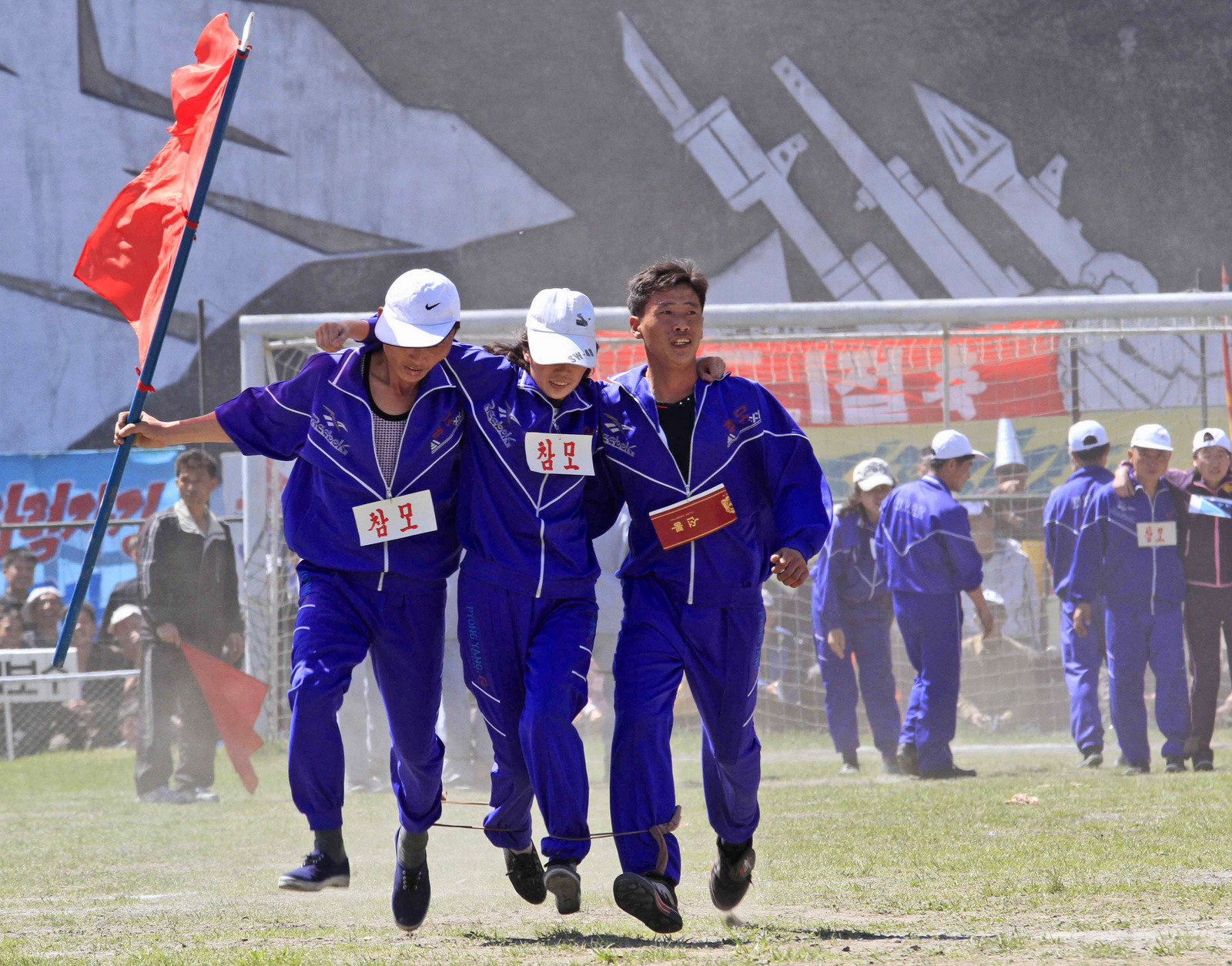 North Korean workers, with their legs tied together, take part in a competition as they celebrate May Day at the Pyongyang Thermal Power Complex in Pyongyang, North Korea, Monday, May 1, 2017. International Workers' Day, which is also known as Labor Day in some countries, is being celebrated worldwide.