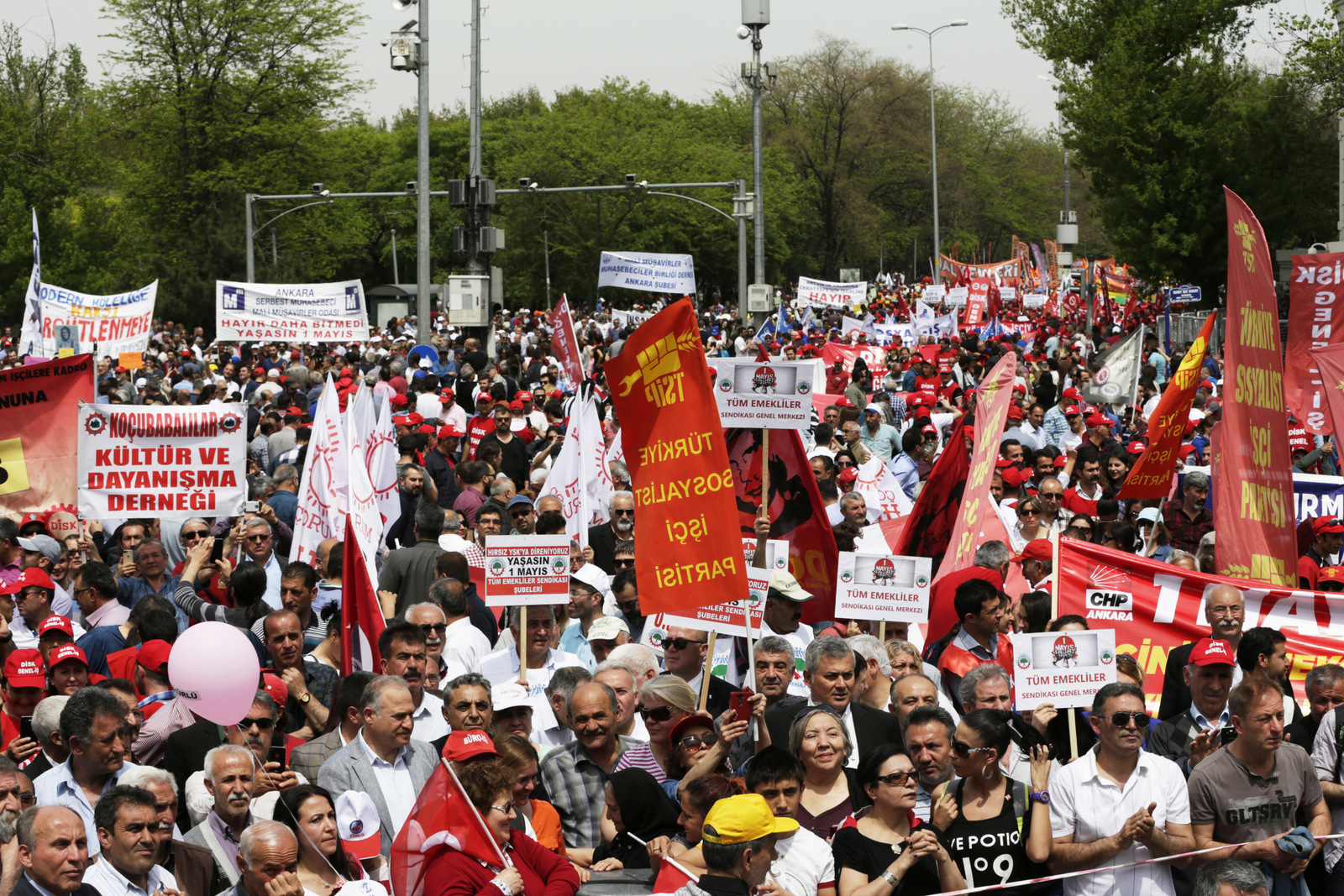 Protesters hold banners during a May day protest in Ankara, Turkey , Monday, May 1, 2017. Workers and activists marked May Day with defiant rallies and marches for better pay and working conditions Monday.