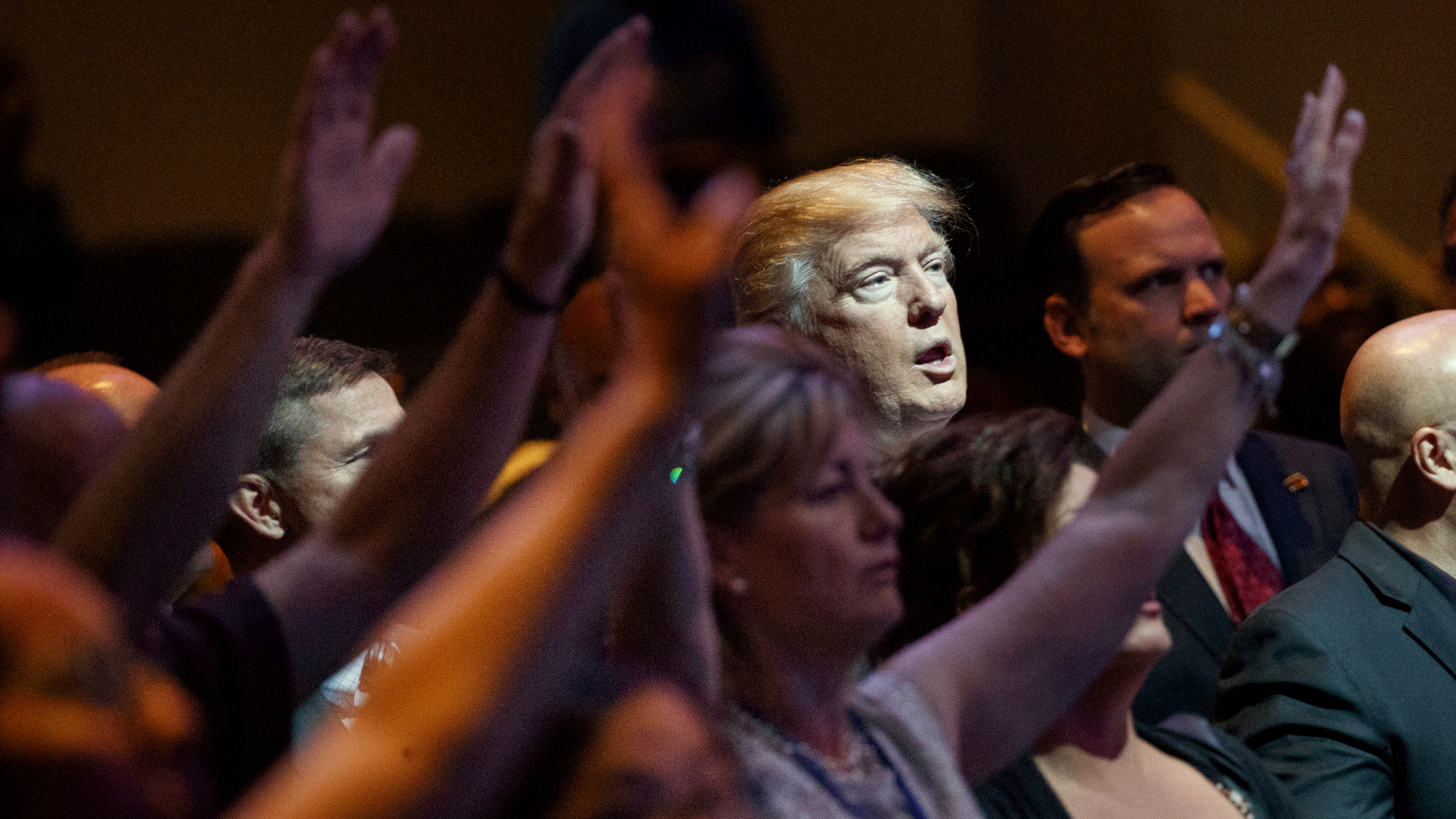 Donald Trump stands during a service at the International Church of Las Vegas in Las Vegas. President Trump’s move to scrap limits on church political activity could have sweeping effects that extend beyond his conservative supporters. (AP/Evan Vucci)