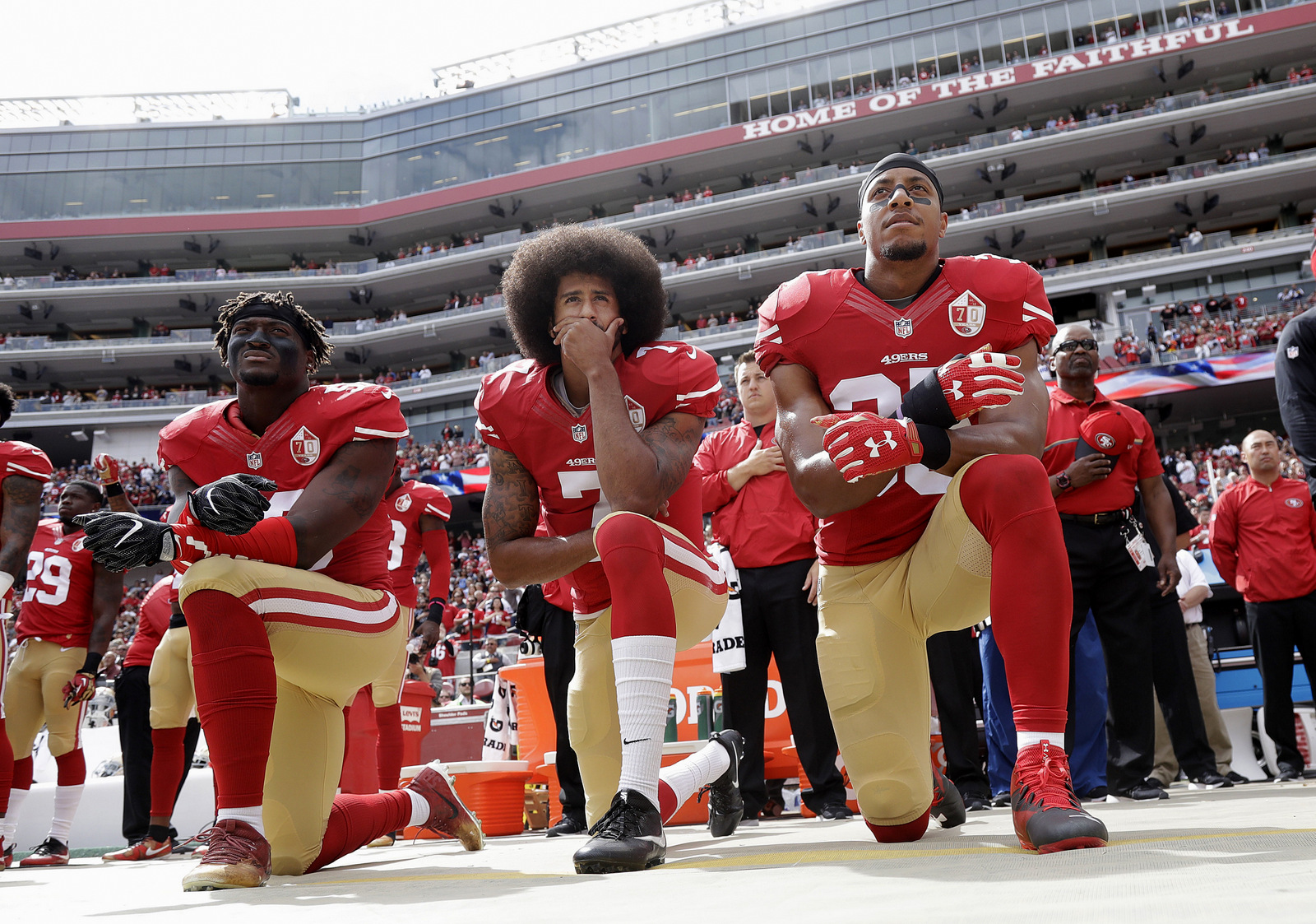 San Francisco 49ers outside linebacker Eli Harold, quarterback Colin Kaepernick and safety Eric Reid kneel during the national anthem before an NFL football game against the Dallas Cowboys in Santa Clara, Calif. (AP/Marcio Jose Sanchez)