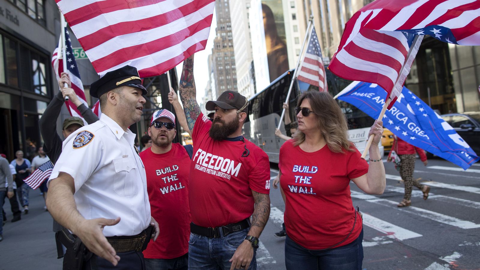 A New York City police chats with demonstrators near Trump Tower, June 3, 2017, in New York. (AP/Mary Altaffer)
